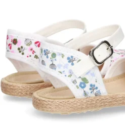 Alpargata niña con hebilla en lona con estampado de FLORES.