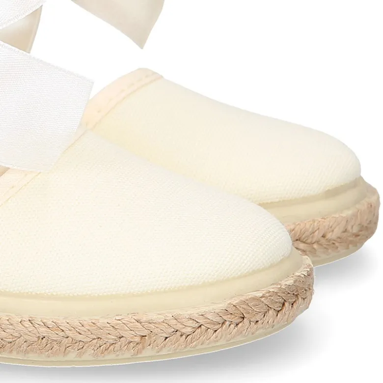 Alpargata niña con LAZO SEDA en lona piqué algodón beige.