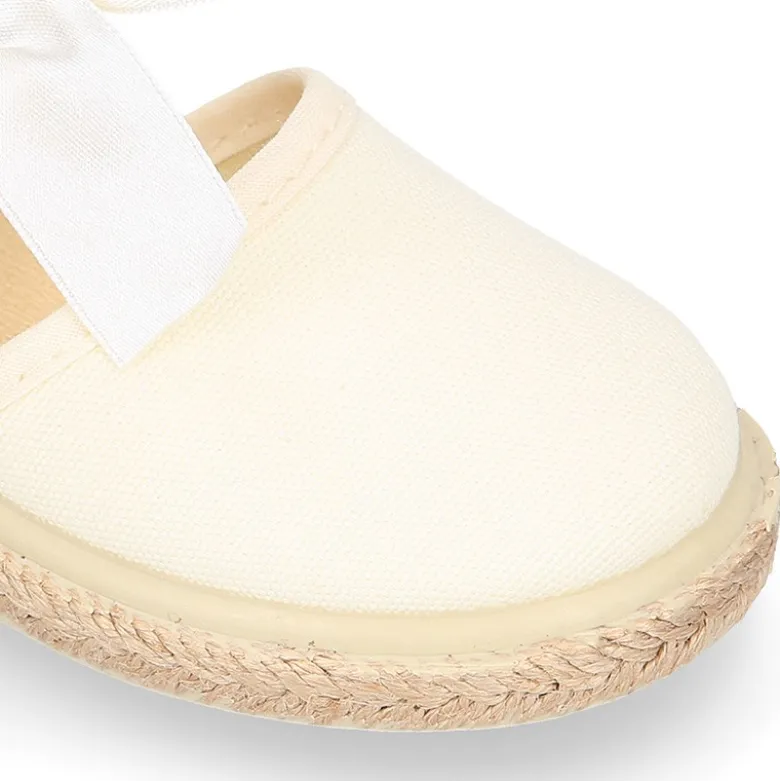 Alpargata niña con LAZO SEDA en lona piqué algodón beige.