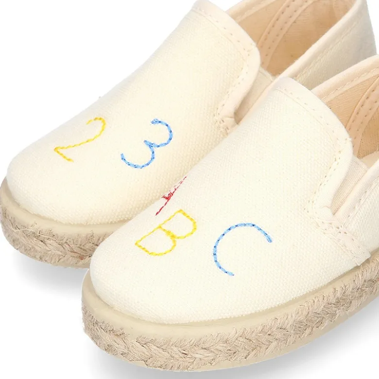 Alpargata niño números y letras con elásticos tipo SLIP ON en lona piqué.