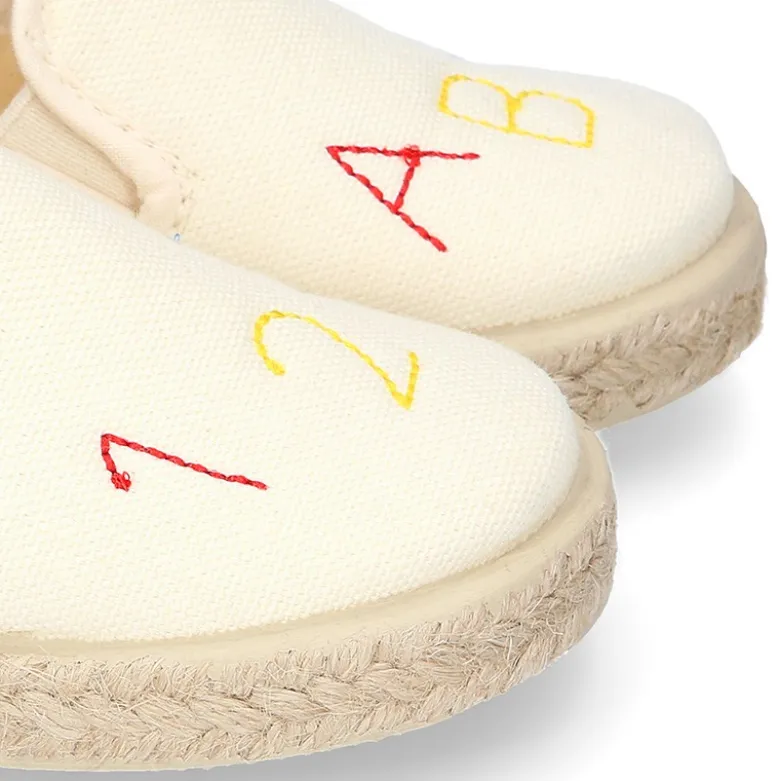 Alpargata niño números y letras con elásticos tipo SLIP ON en lona piqué.