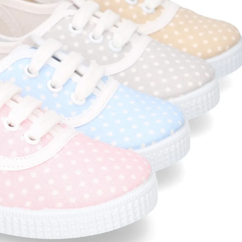 Bamba en lona con cordones y estampado lunares en pasteles.