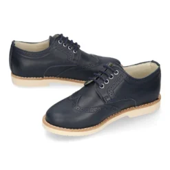 Blucher niño ceremonia con cordones en piel napa marino.