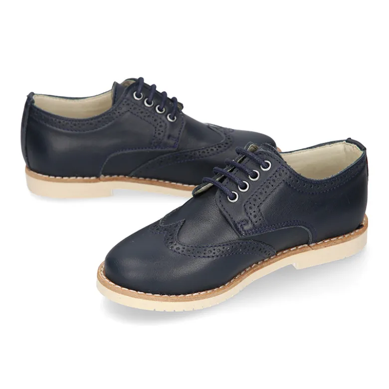Blucher niño ceremonia con cordones en piel napa marino.