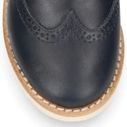 Blucher niño ceremonia con cordones en piel napa marino.