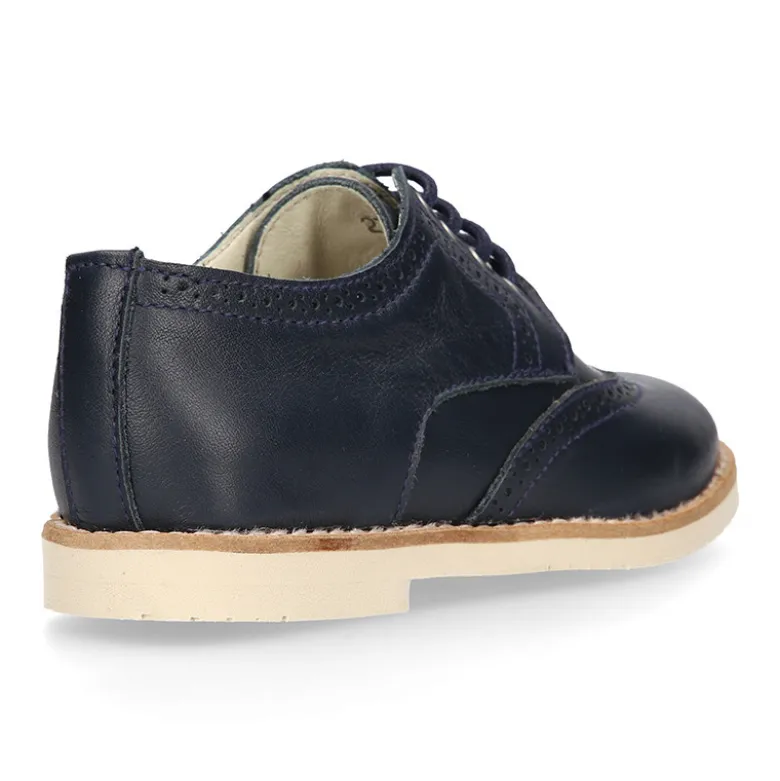 Blucher niño ceremonia con cordones en piel napa marino.