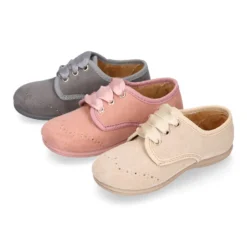 Blucher niños con cordones con lazos y picados en Serratex.