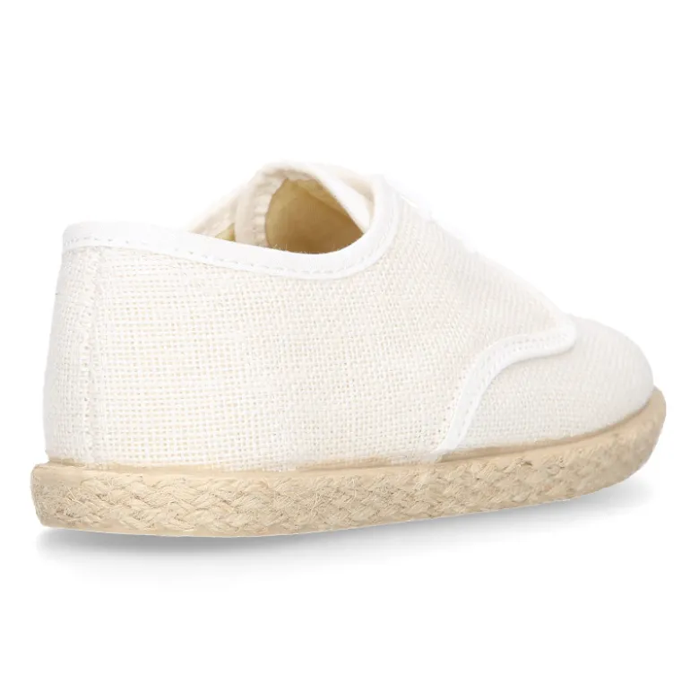 Blucher niños tipo alpargata con cordones en lino blanco.