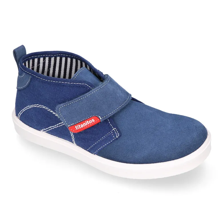 Bota tipo zapatilla sin cordones en lona y serraje.
