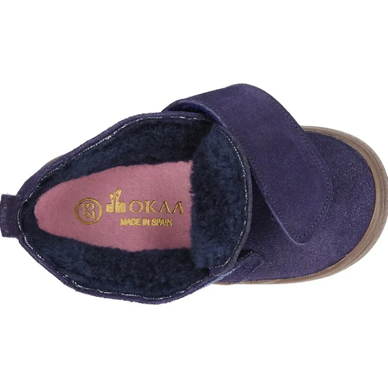 Botita casual sin cordones con borrego interior en piel serraje.