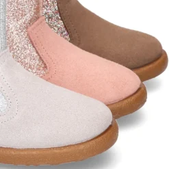 Botita con cremallera y GLITTER en piel Serraje.