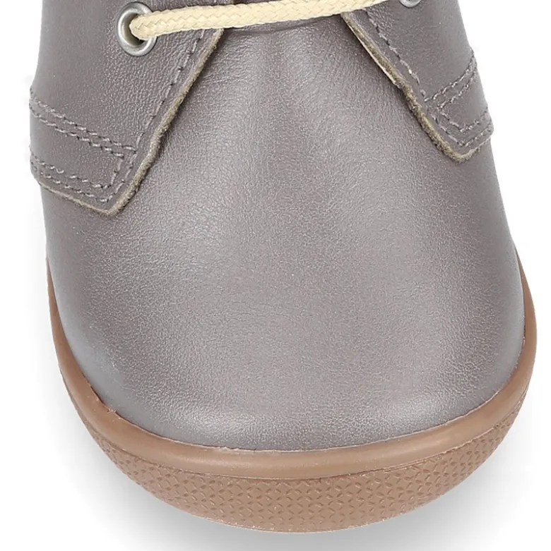 Botita niños cordones con puntera y talonera en piel EXTRA SUAVE.