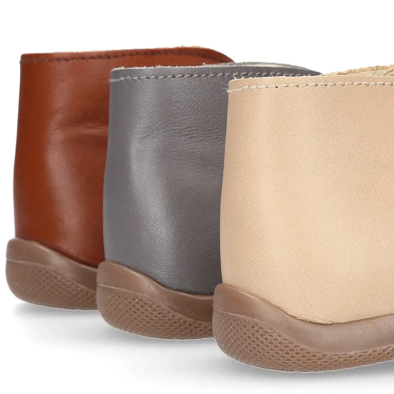 Botita niños cordones con puntera y talonera en piel EXTRA SUAVE.