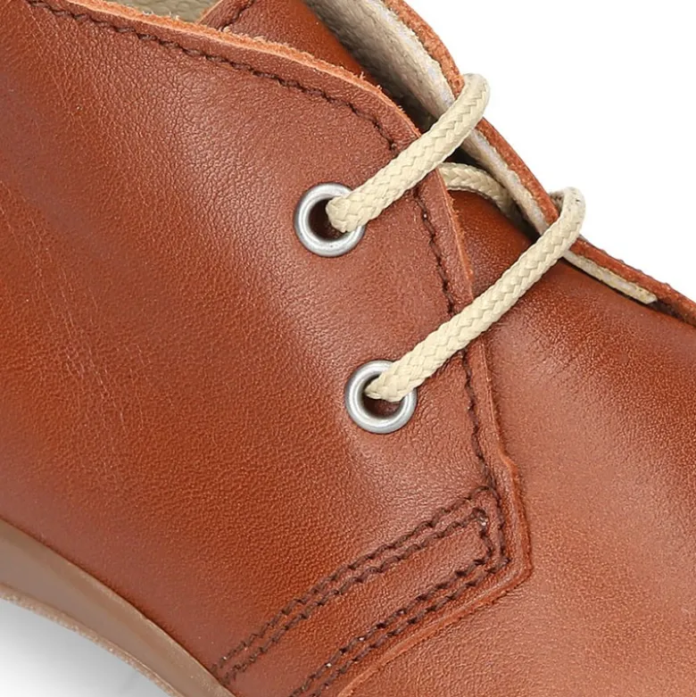 Botita niños cordones con puntera y talonera en piel EXTRA SUAVE.