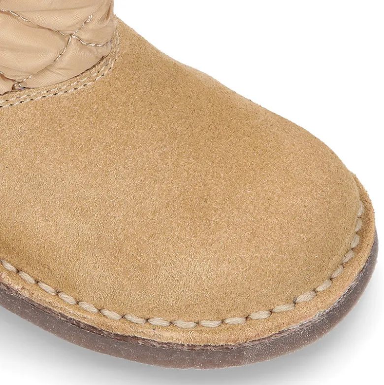 Botita niños tipo Australiana con cremallera y BORREGO interior en piel serraje y Nylon.