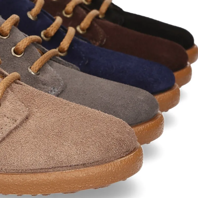 Botitas casual niño con cordones en piel serraje.