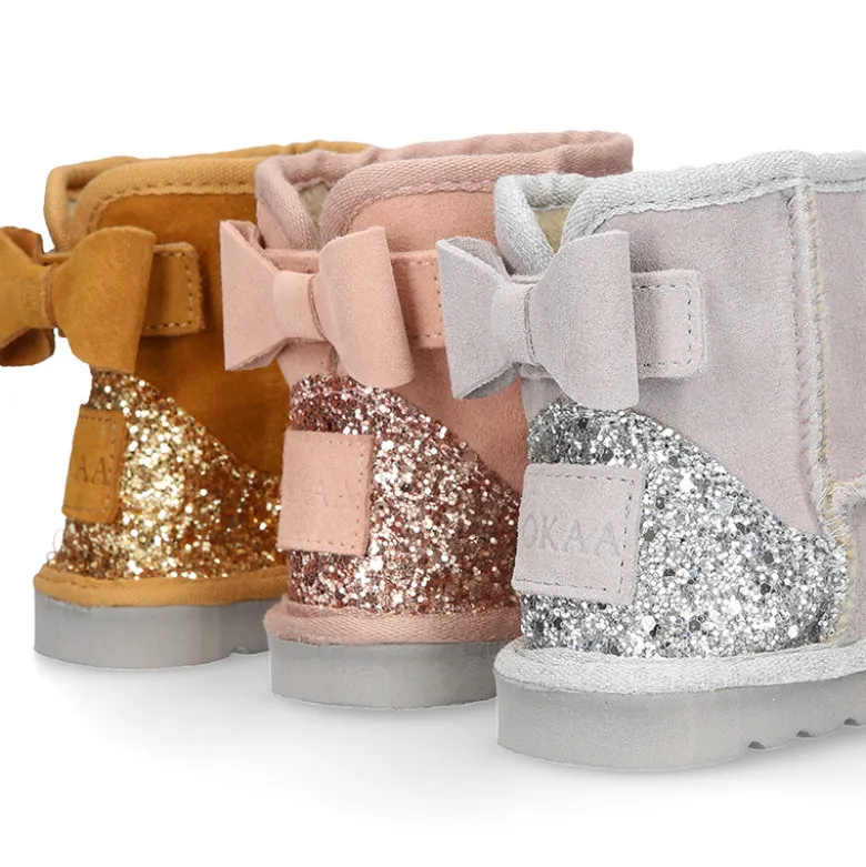 Botitas niña tipo Australianas niña en piel serraje con LAZO y GLITTER.