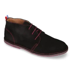 Botín tipo blucher para vestir con cordones, suela y cosidos a contraste en serraje.