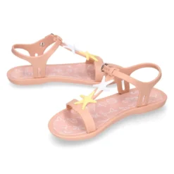 Cangrejera niña tipo sandalia en forma de T con ESTRELLAS en rosa.