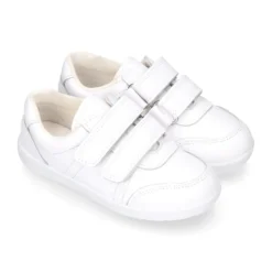 Deportiva colegial niños clásica sin cordones y puntera reforzada en piel lavable.