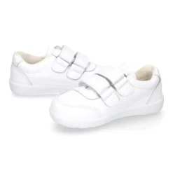 Deportiva colegial niños clásica sin cordones y puntera reforzada en piel lavable.