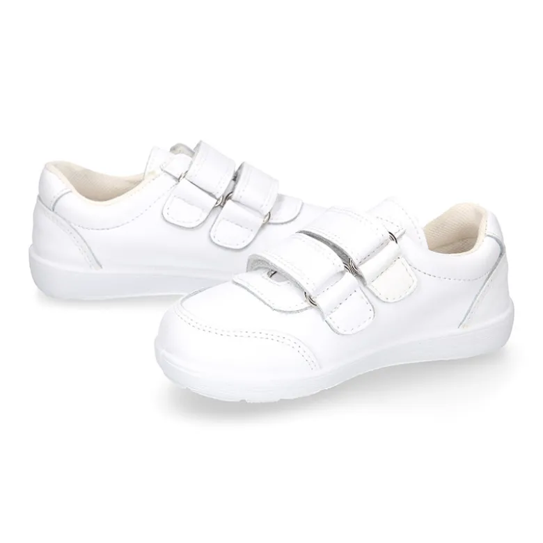 Deportiva colegial niños clásica sin cordones y puntera reforzada en piel lavable.