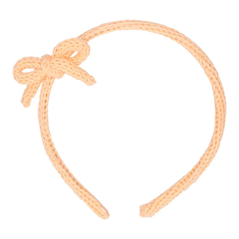 Diadema para el pelo de niña con lazo en lana de colores de primavera verano.