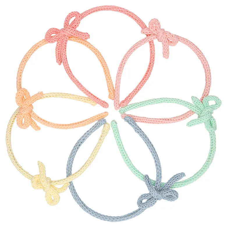 Diadema para el pelo de niña con lazo en lana de colores de primavera verano.