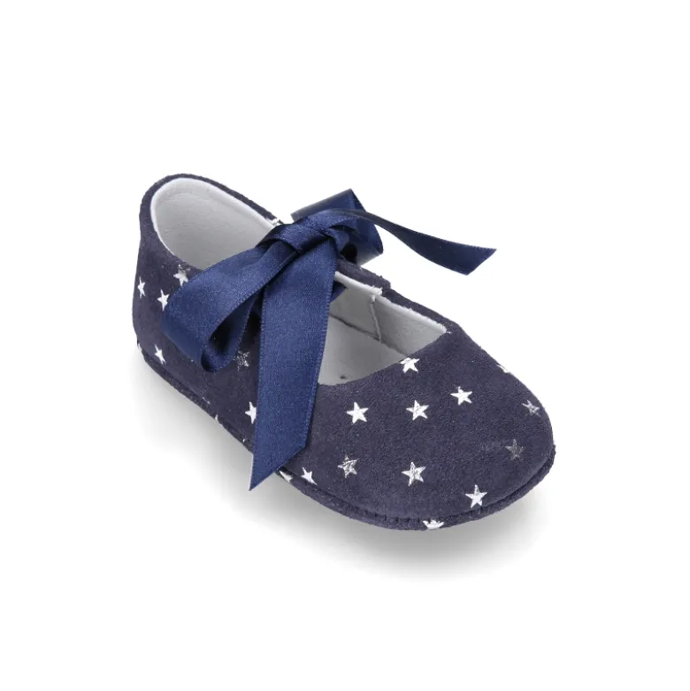 Mercedita bebé con lazo en piel serraje con ESTRELLAS.