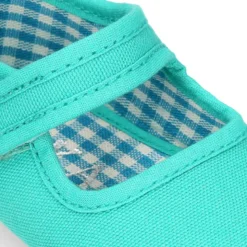 Mercedita con cierre adherente en lona piqué para bebés.