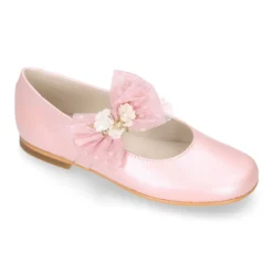 Mercedita niña ceremonia en piel rosa empolvado con flor de tul.