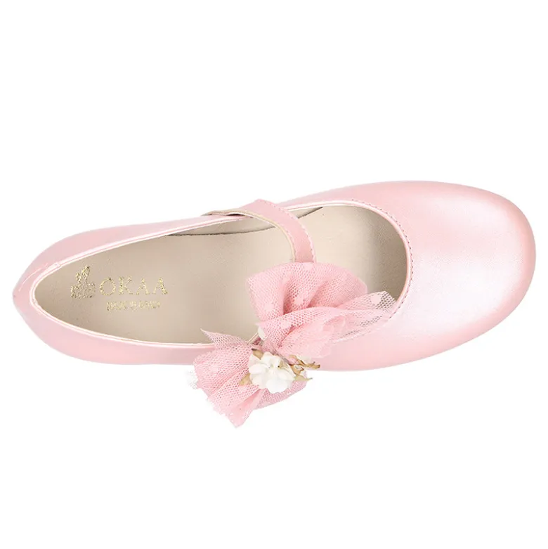 Mercedita niña ceremonia en piel rosa empolvado con flor de tul.