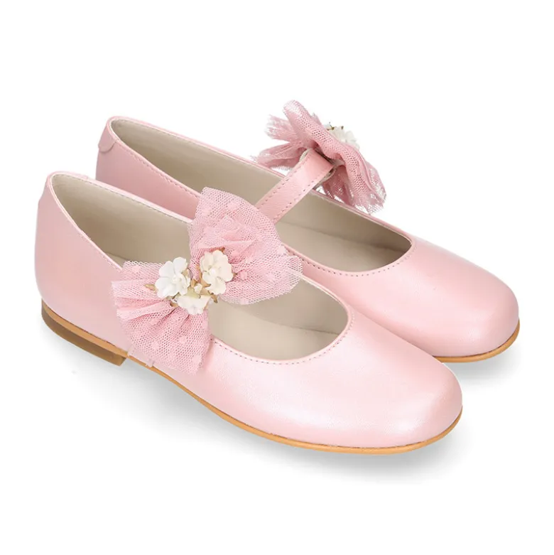 Mercedita niña ceremonia en piel rosa empolvado con flor de tul.