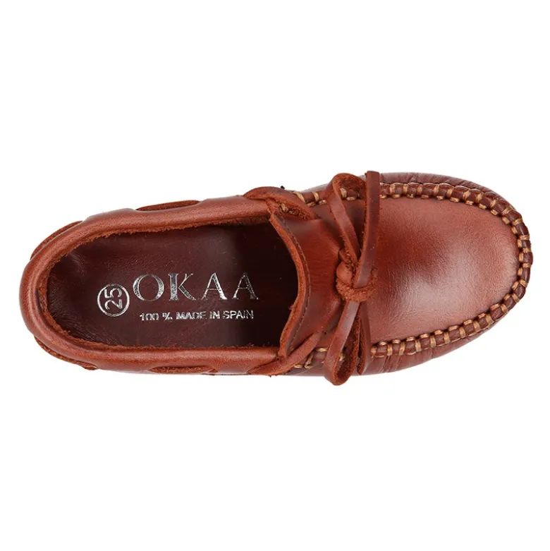 Mocasín lazos mayores en piel trabajada.