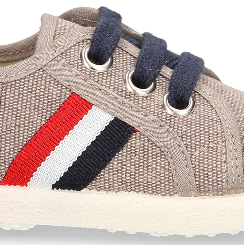 Nuevo Tenis con cordones en lona EFECTO LAVADO con bandera lateral.