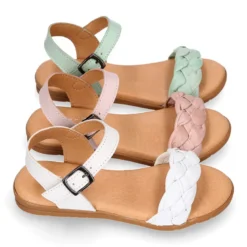 Sandalia Niña con diseño trenzado en piel suave en colores pastel.