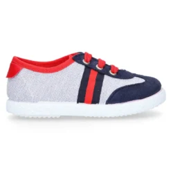 Tenis niño combinado en lona con cordones.