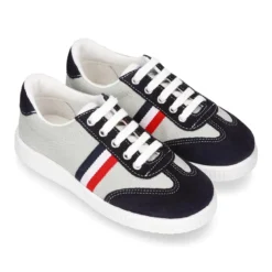 Tenis niño combinado en lona y serraje con cordones.