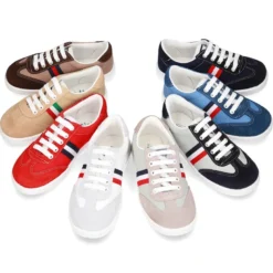 Tenis niño combinado en lona y serraje con cordones.