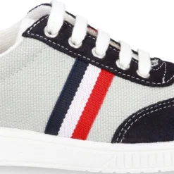 Tenis niño combinado en lona y serraje con cordones.