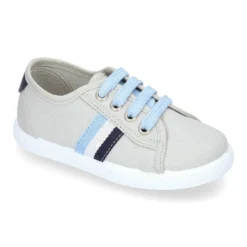 Tenis niño con cordones en lona con bandera.