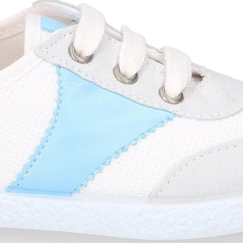 Tenis niños combinado en lona algodón y cordones.