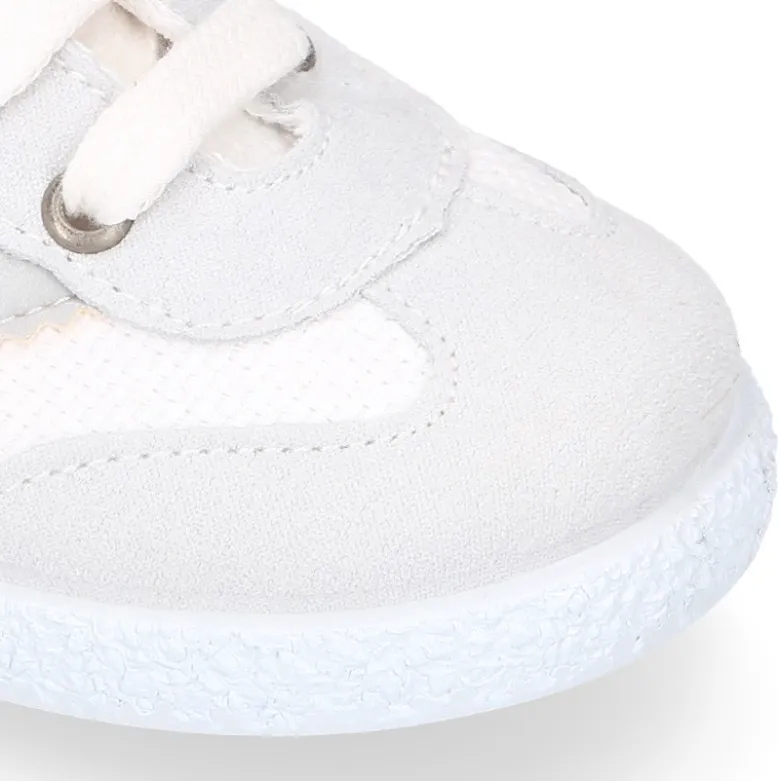 Tenis niños combinado en lona algodón y cordones.