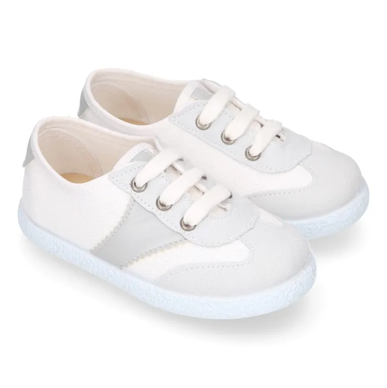 Tenis niños combinado en lona algodón y cordones.