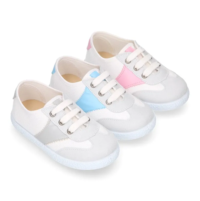 Tenis niños combinado en lona algodón y cordones.