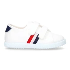 Tenis niño sin cordones en lona con bandera.