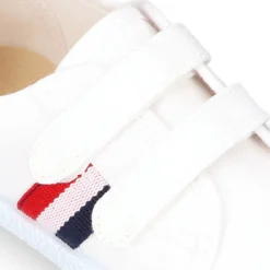 Tenis niño sin cordones en lona con bandera.