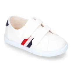 Tenis niño sin cordones en lona con bandera.