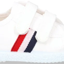 Tenis niño sin cordones en lona con bandera.