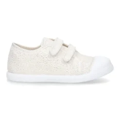 Zapatilla con puntera y sin cordones en lona metalizada.